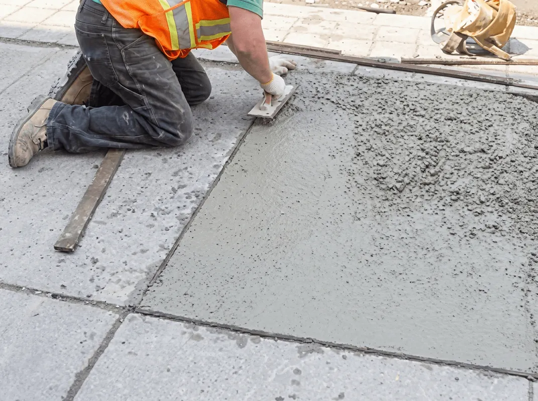 Professional repairing a concrete floor in Aurora, IL