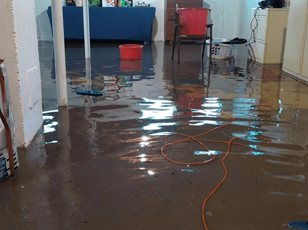 Basement with boiler, cabinets and washing machine completely flooded in Aurora, IL
